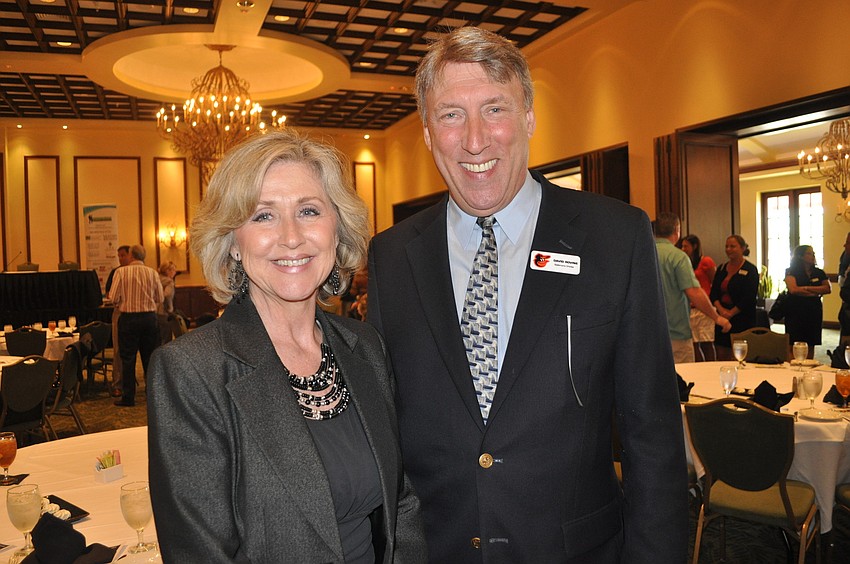 Valerie Vale of the Manatee County Medical Society and David Rovine, vice president of the Baltimore Orioles-Sarasota
