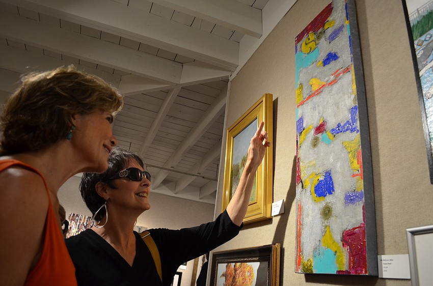 Katie Cassidy and Grace Howl admire Grace Howlâ€™s â€œBird on a Wireâ€