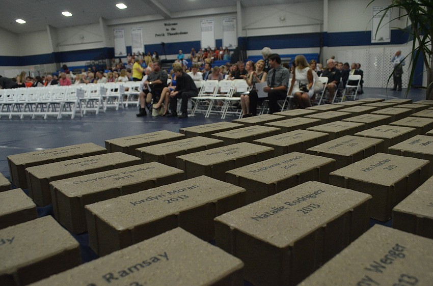 Students received bricks with their name on them after crossing the stage.