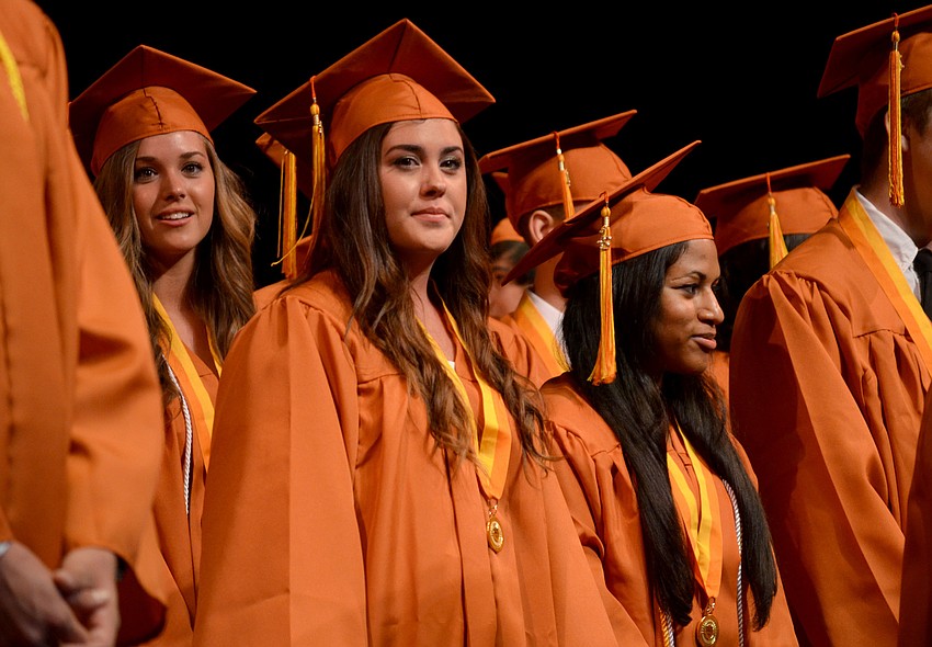 Seniors listen as studentsâ€™ names are called.