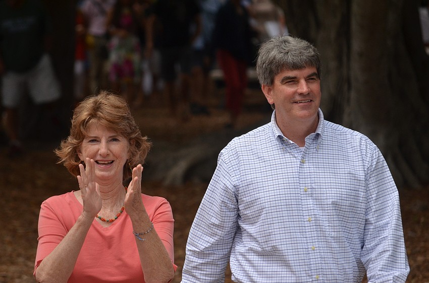 Glendy Huene and David Mahler walk towards the surprise reception.