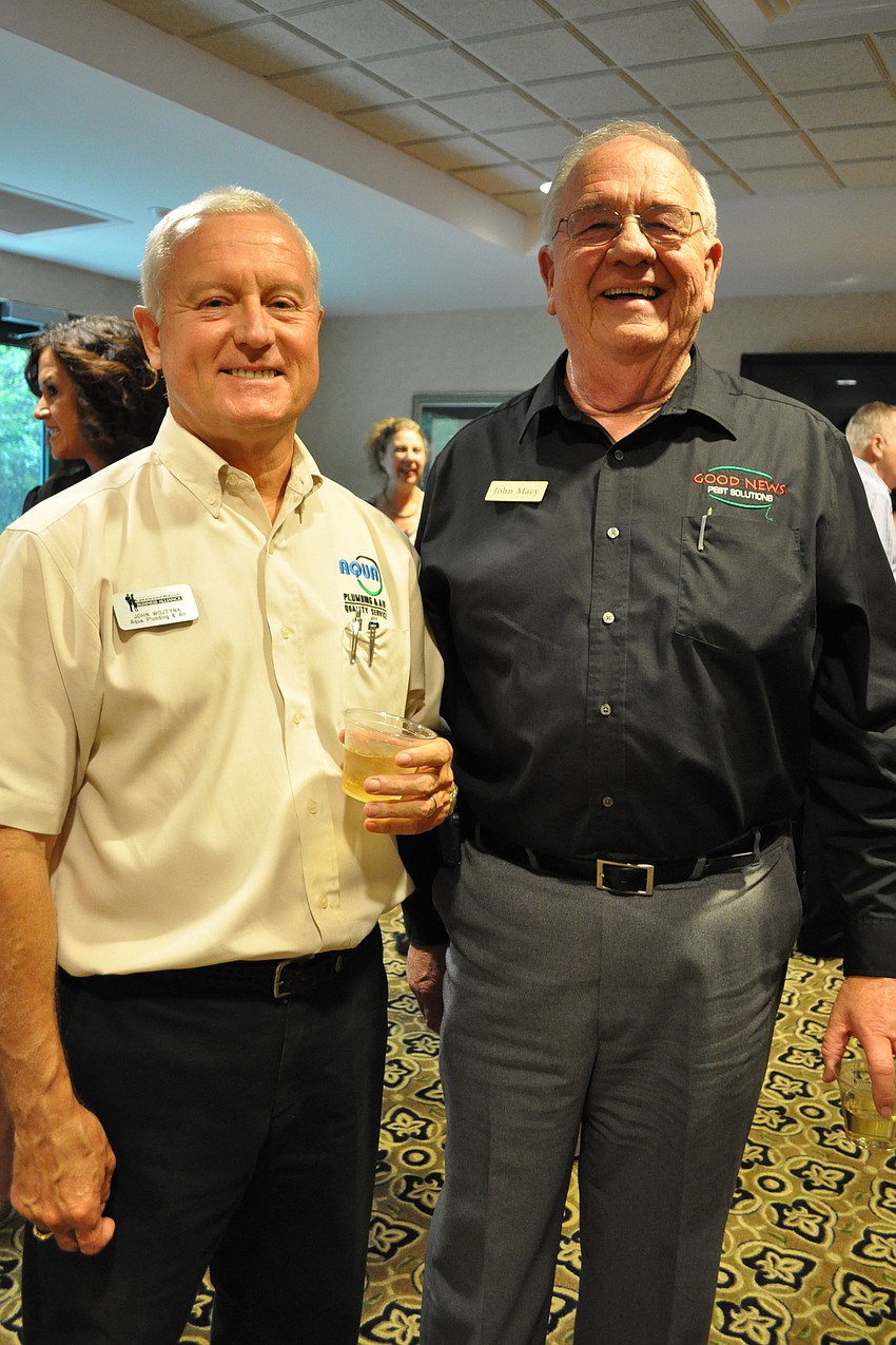 John Wojtyna, of Aqua Plumbing & Air, with John Macy, of Good News Pest Solutions
