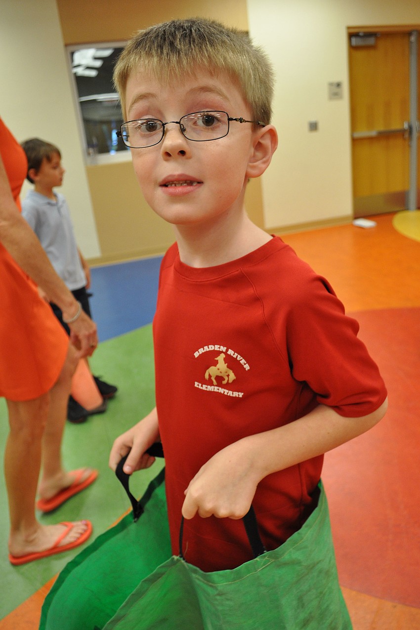 Landen Ling, a first grader at Braden River, gave his all during the potato sack race.