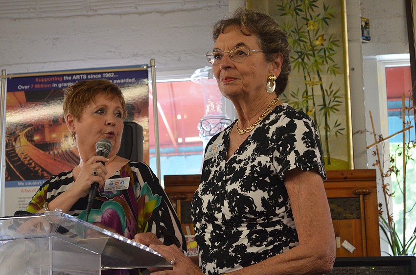 Scholarship committee members Laurel Roberts and Suzanne Raymond announced grant and scholarship recipients.