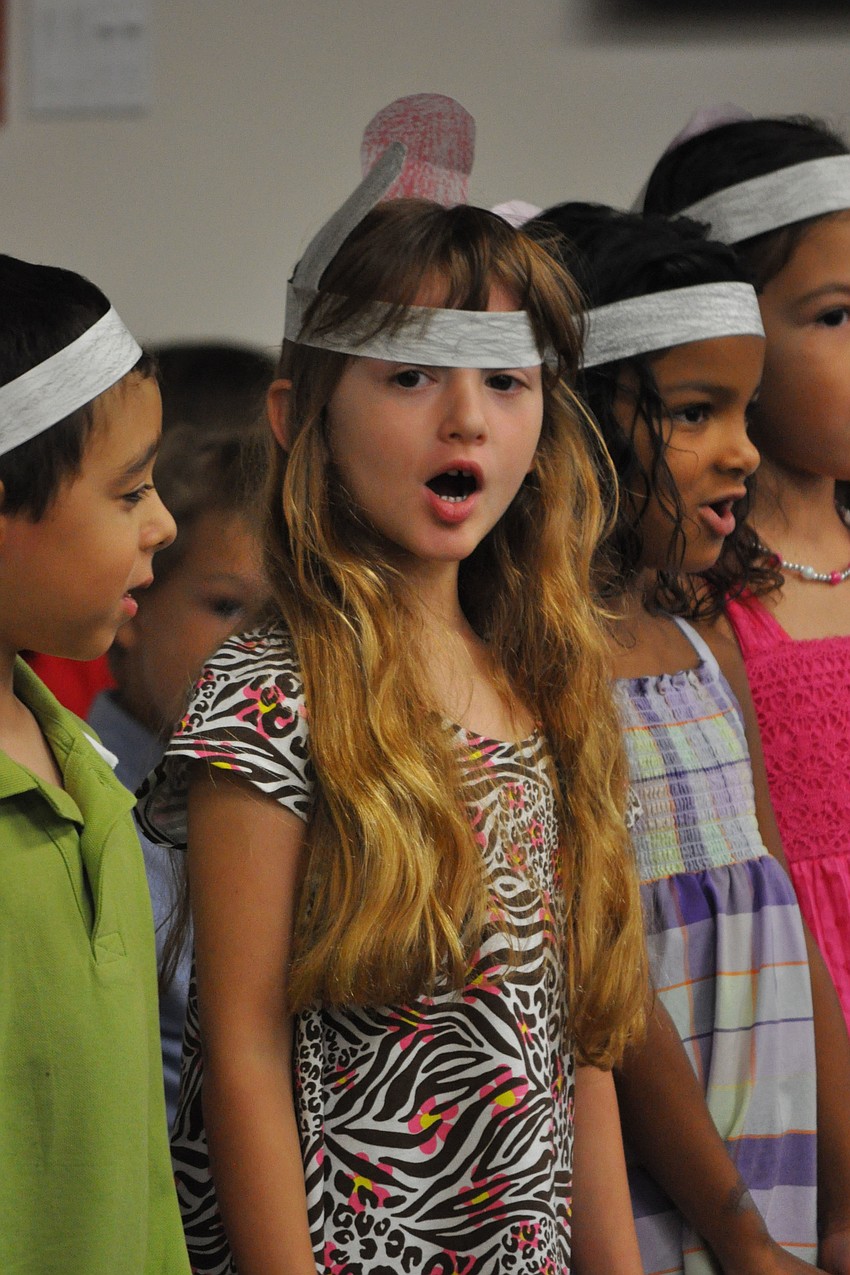 Madison Downes, center, knew the words to all the songs.