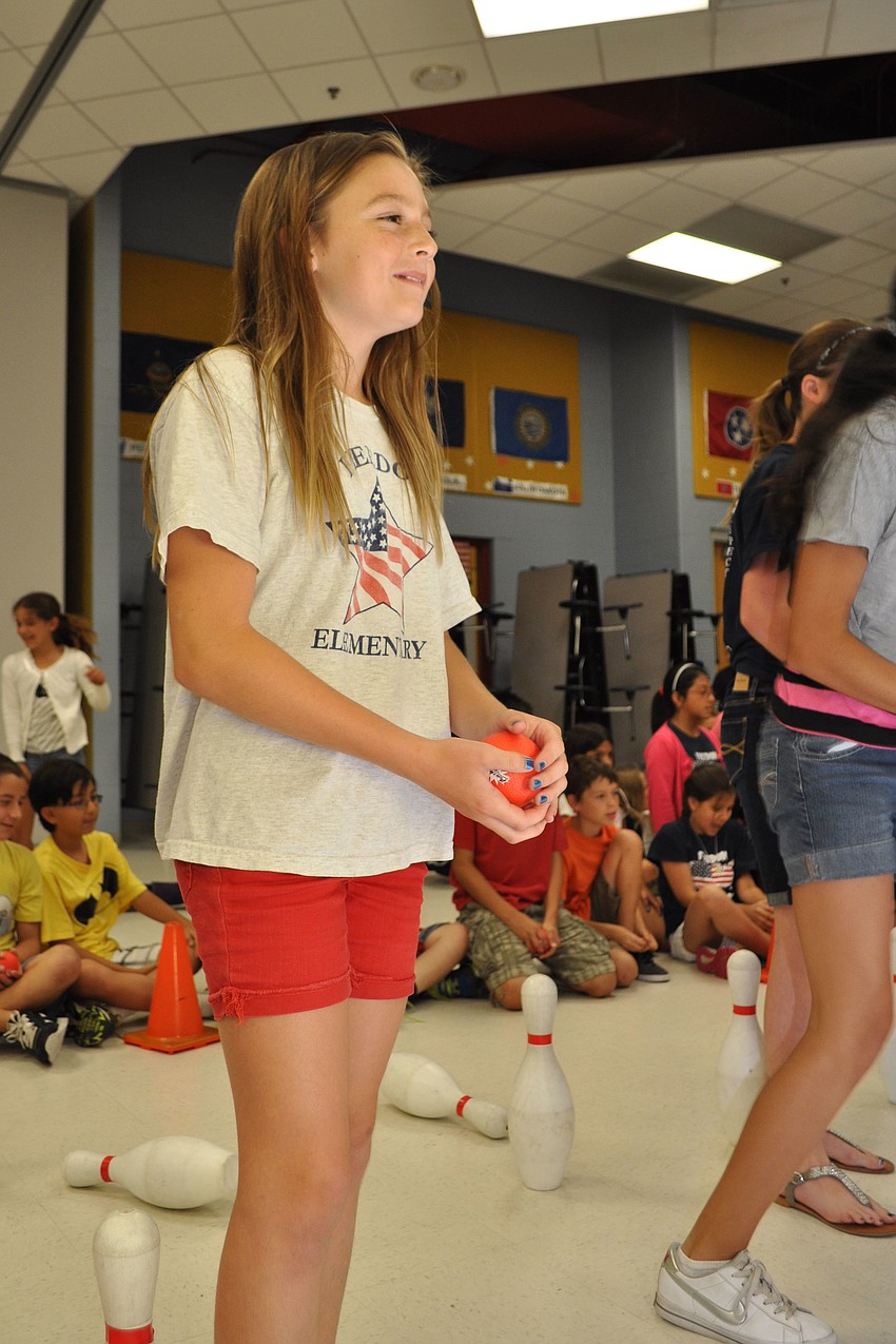 Emily Wilcox finds a spot to throw her ball, during a game of 