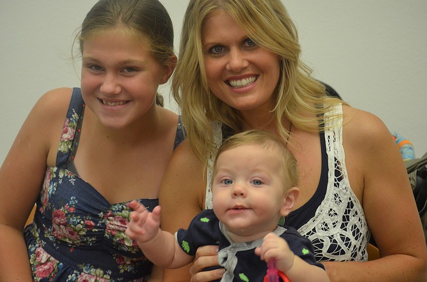 Jacey Krueger, 12 with her mom Christine and 5-month-old brother Brooks