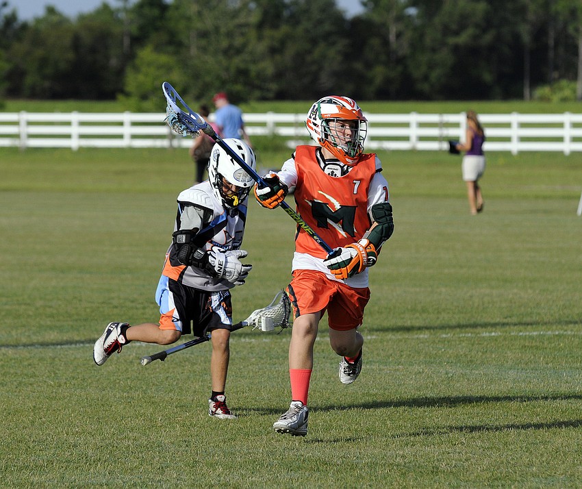 Eleven-year-old Sam Millie brings the ball up the field for the Monsters U11 Green team.