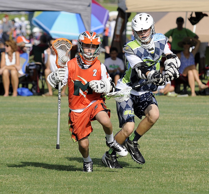 Chip Jackson, 13, attempts to hold off a Tampa Elite defender.