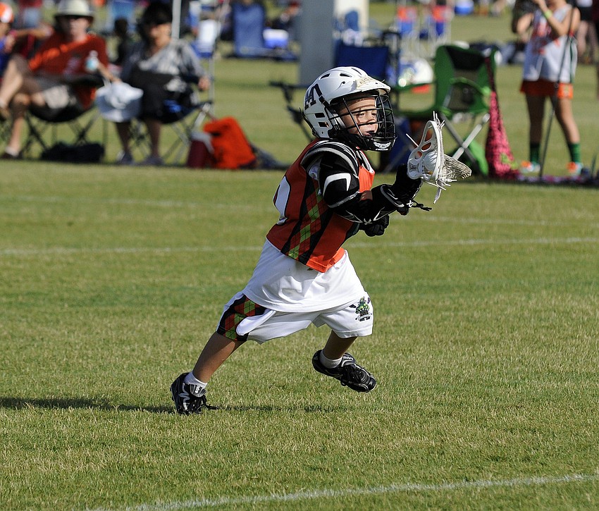 Five-year-old Mickey Cohen races toward the goal.
