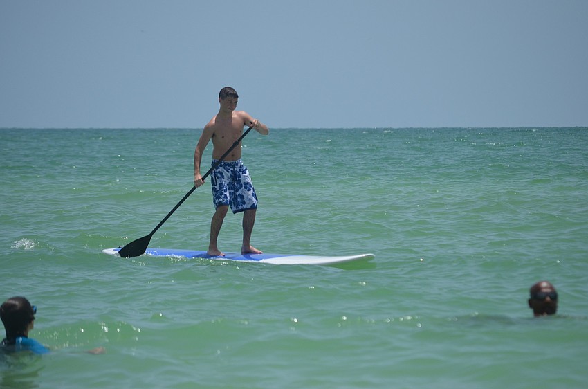 Zachary McDonough was visiting from Long Island, NY when he decided to try out paddle boarding at the Kids Paddle session.