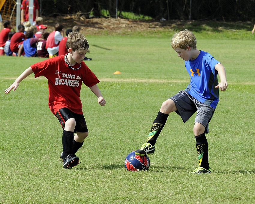 James Buttari, 8, and Jonah Hayden, 9, compete during a team wars competition.