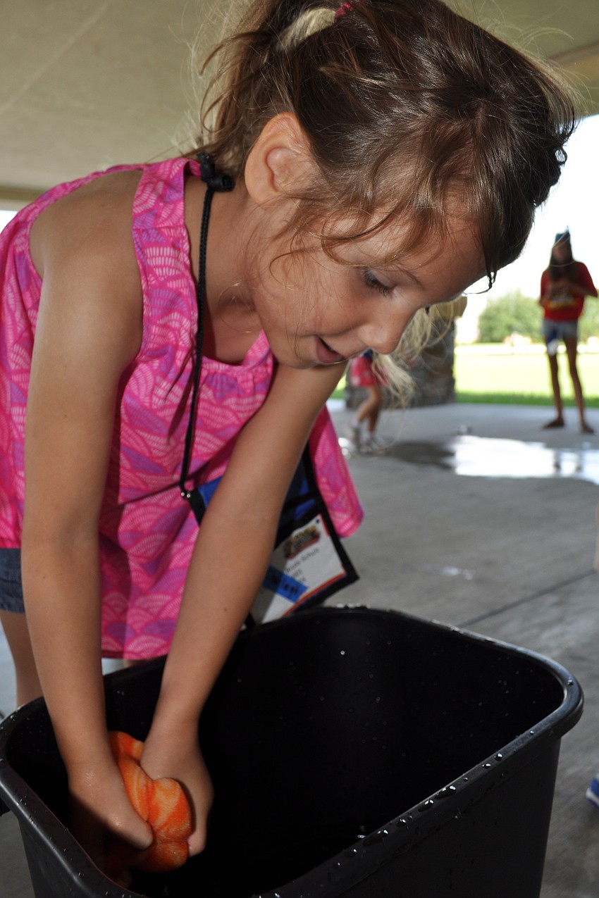 Charleigh Bruss-Schulz, 5, doesn't mind getting wet.