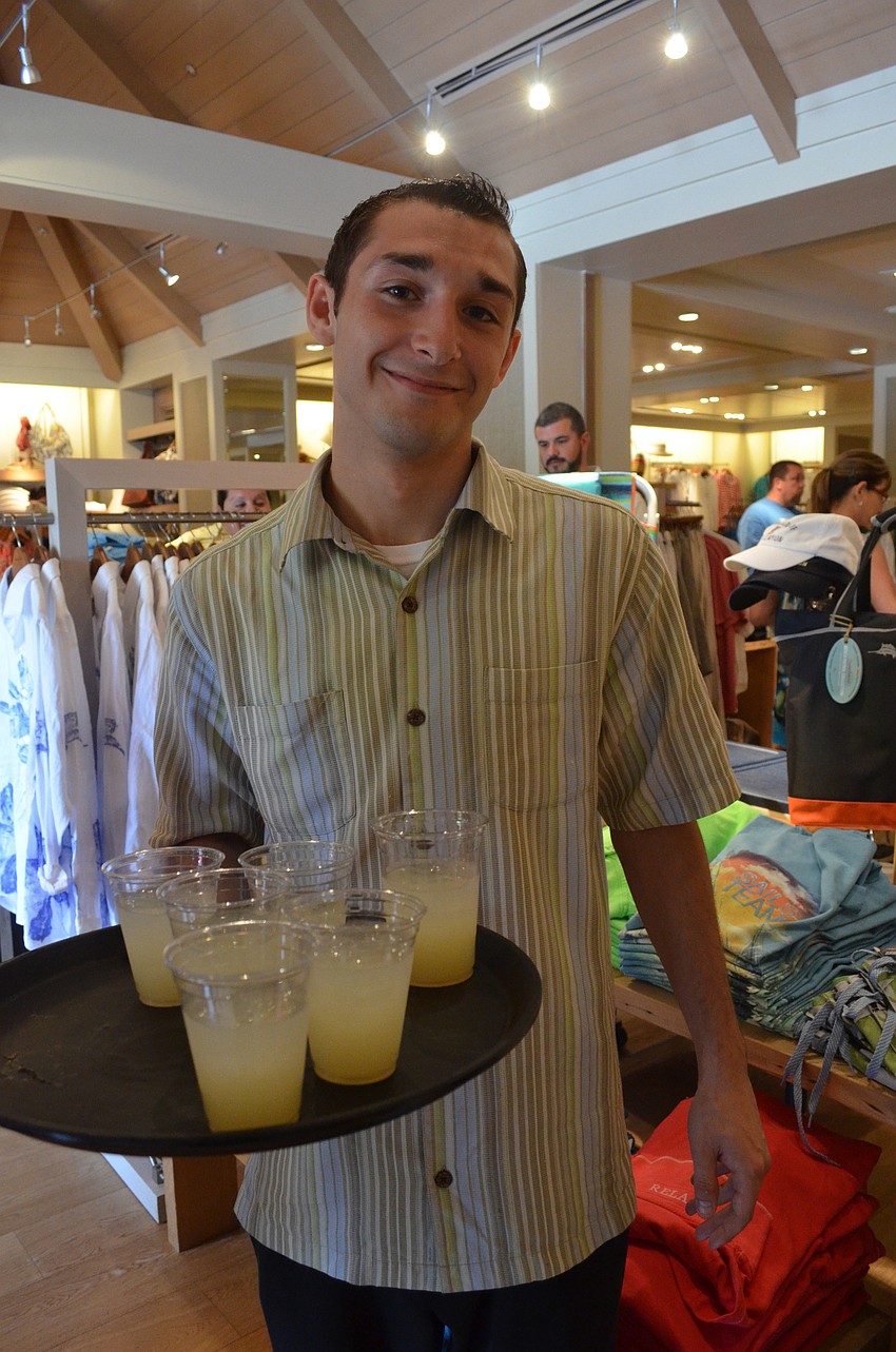 Server Christian Zinchine offers customers basil mint lemonade.