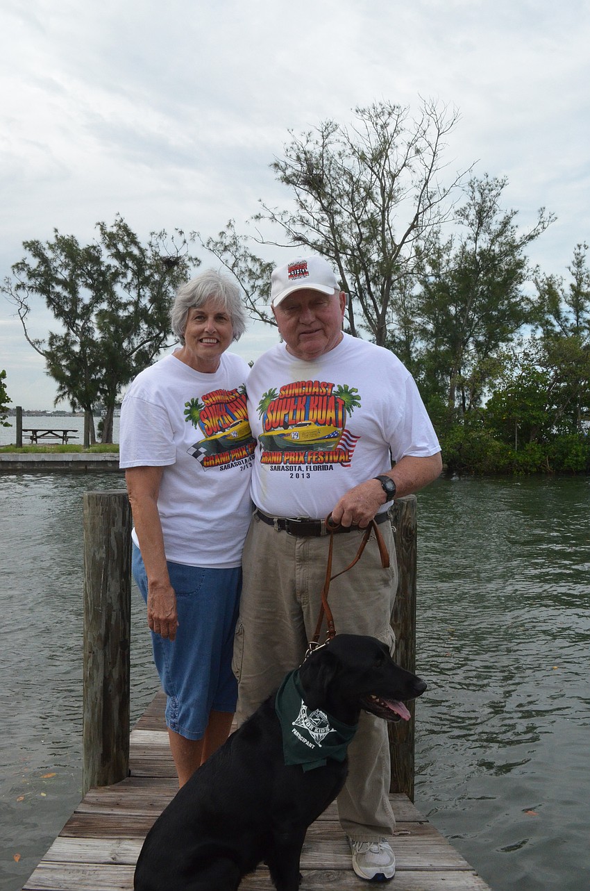Denise and Don Fisher take their black lab and certified therapy dog Lucki with them to many childrenâ€™s events and All Childrenâ€™s Hospital.