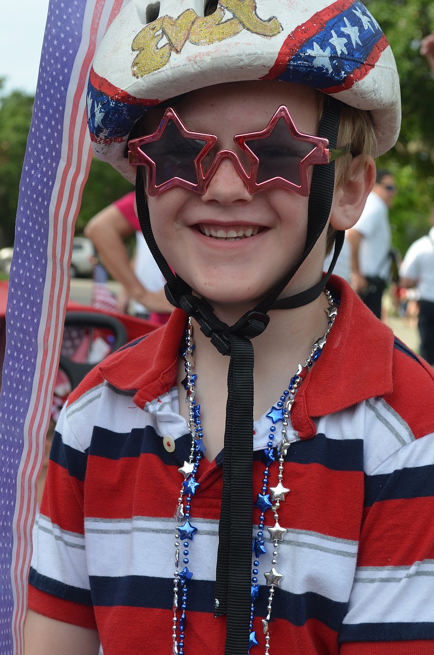 Jacob Jensen, 7, rides his decorated bike in the parade.