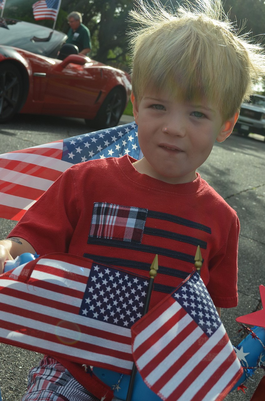 Rhys Parry rides his patriotic bike in the parade.
