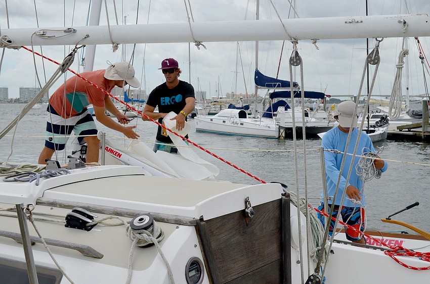 Sailors prepare their boats.