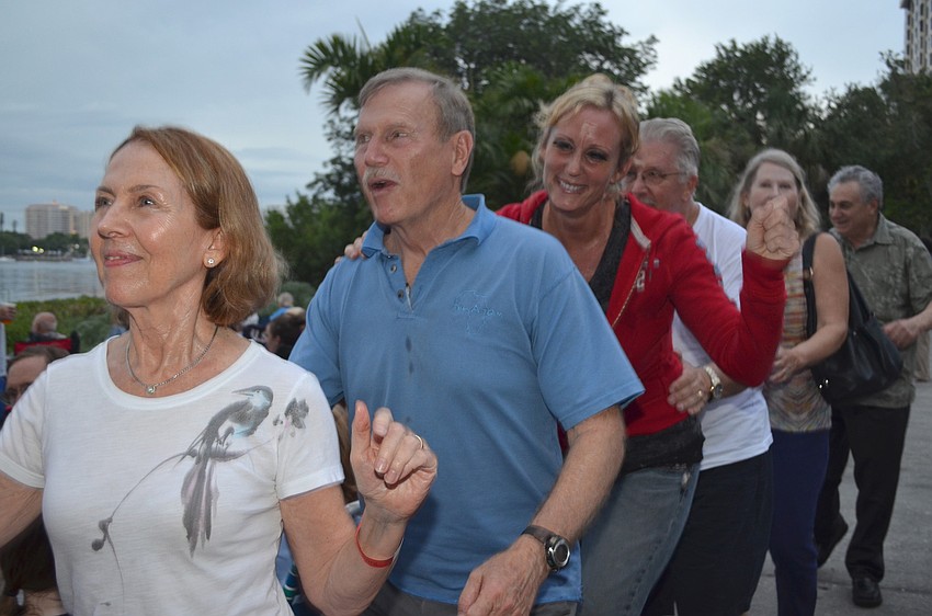 Carolee Parker, Bob Williams, Marilyn Miller and Keith Burnett attempt to get the crowd moving with a conga line.