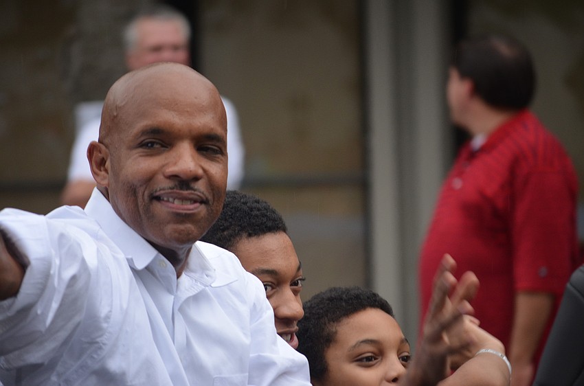Deputy City Manager Marlon Brown waves to the crowd.