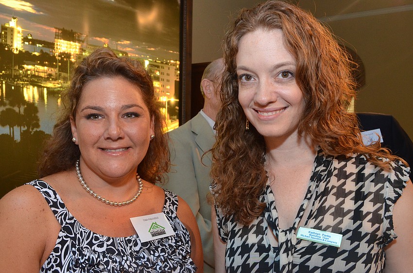 Tina Figliuolo of the Charlotte County Homeless Coalition and Kathryn Purks of Michael Saunders & Company