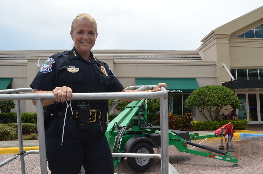 Sarasota Police Chief Bernadette DiPino stays in a makeshift bucket until the goal of 150 units of blood or 150 pints is met.