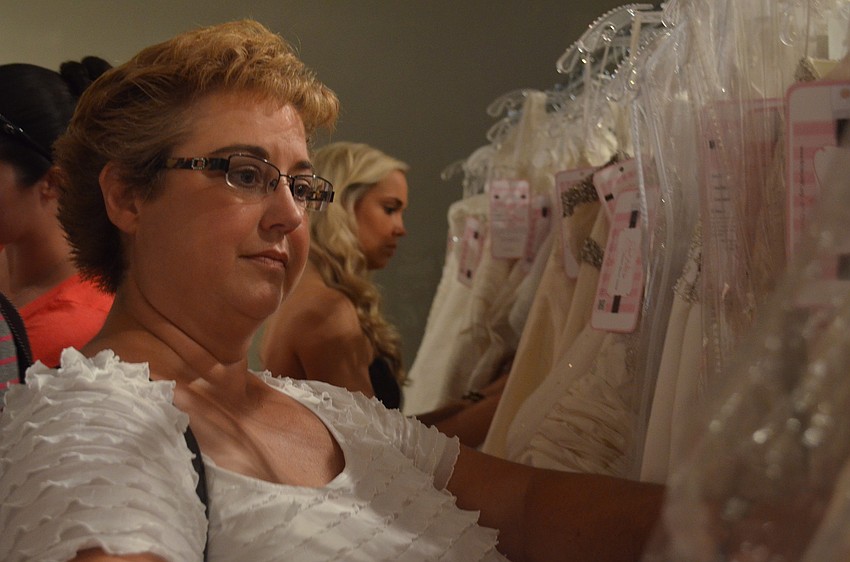 Kerri Tate flew in from Dallas to help her daughter Emily find a dress.