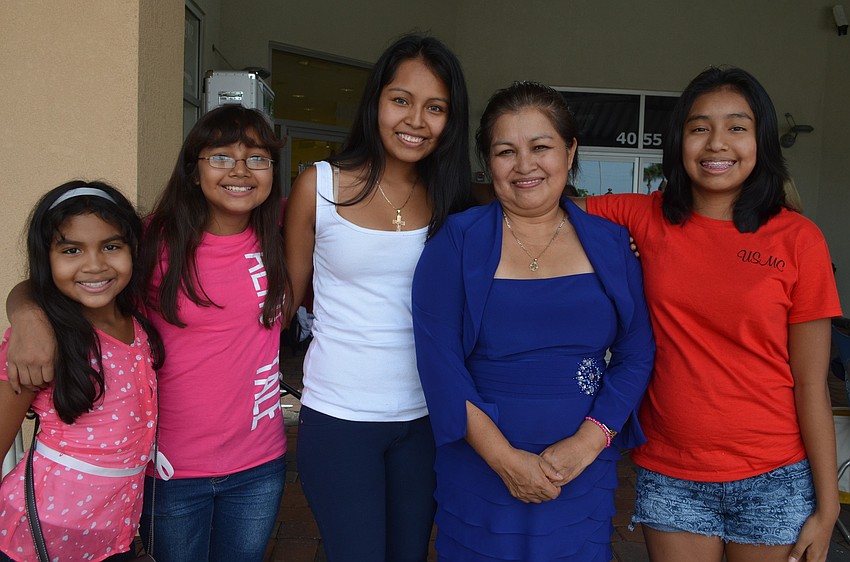 Evelyn and Stacey Mora help their mother Diane Cruz look for a dress with their grandmother Guadalupe Cruz and aunt Estefany Cruz. Diane Cruz will be married to her Marine fiancÃ© March 1, 2014.