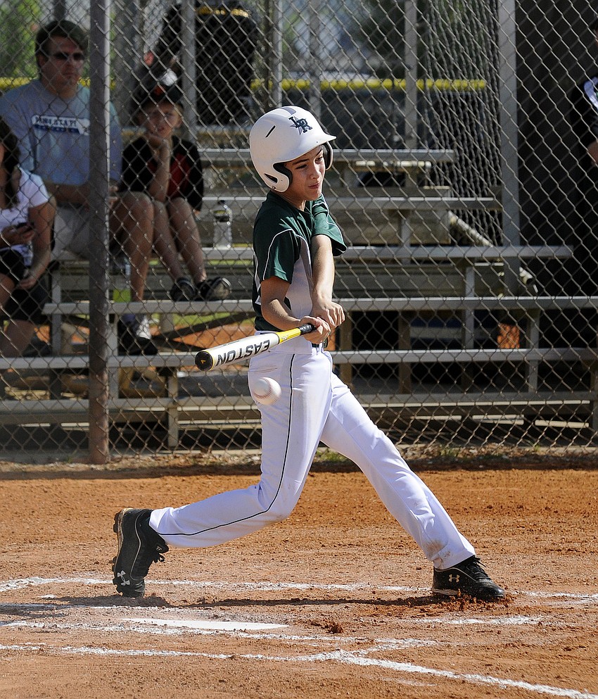 Blake Wood makes contact during his first trip to the plate July 13.