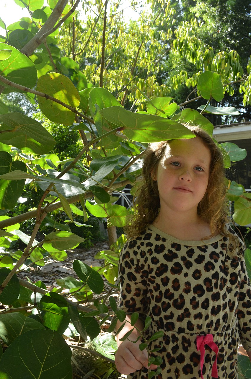 Paige Florand, 6, takes the nature tour with other children.