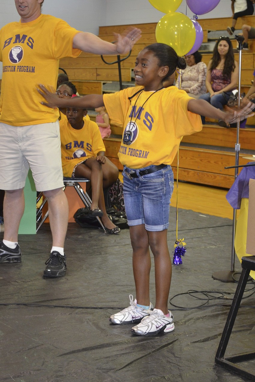 Jaela Dennis demonstrating what she learned in P.E. this summer.