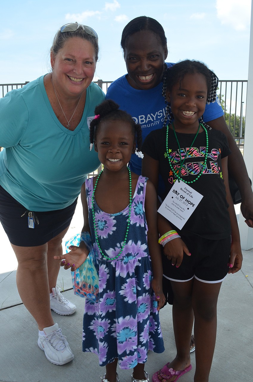 Dawn Leinaweaver, Barbara Garrison, Jamiya Evans, 4, and Danâ€™aejah Edwards, 9