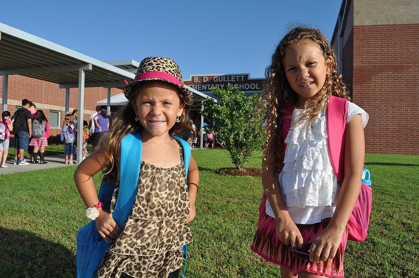 Chiara and Anatalia Diaz ready pause for one last picture before embarking on their first day back at school at Gullett Elementary.