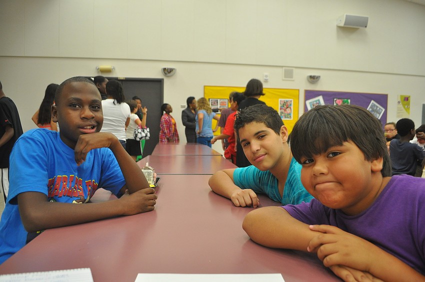 Isazier Whitfield, Oasniel Sanchez, and Bryan Mendoza relax during lunch at Booker VPA.