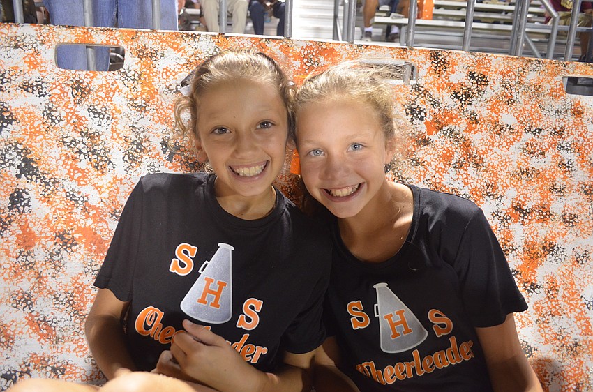 Hailey Mavriks, 10, and Abbi Wilkins, 10, cheer on the Sarasota Sailors.