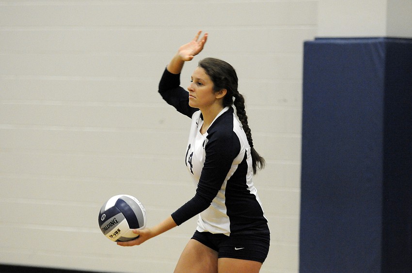 Junior Taylor Albano prepares to serve for the Lady Thunder.