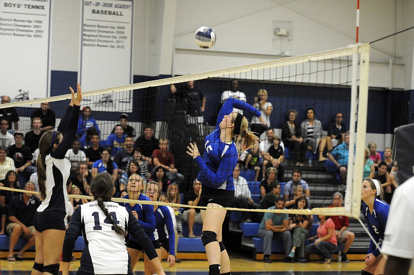 Sarasota Christianâ€™s Anikka Jensen attempts to put the ball past ODA setter Monica Costa.