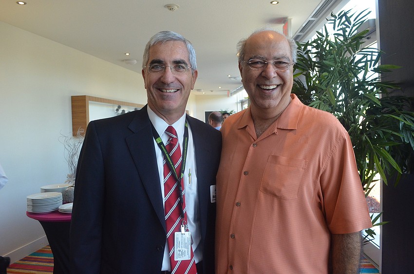 Sarasota Bradenton International Airport President and CEO Rick Piccolo and Holiday Inn General Manager Mohammad Gharavi