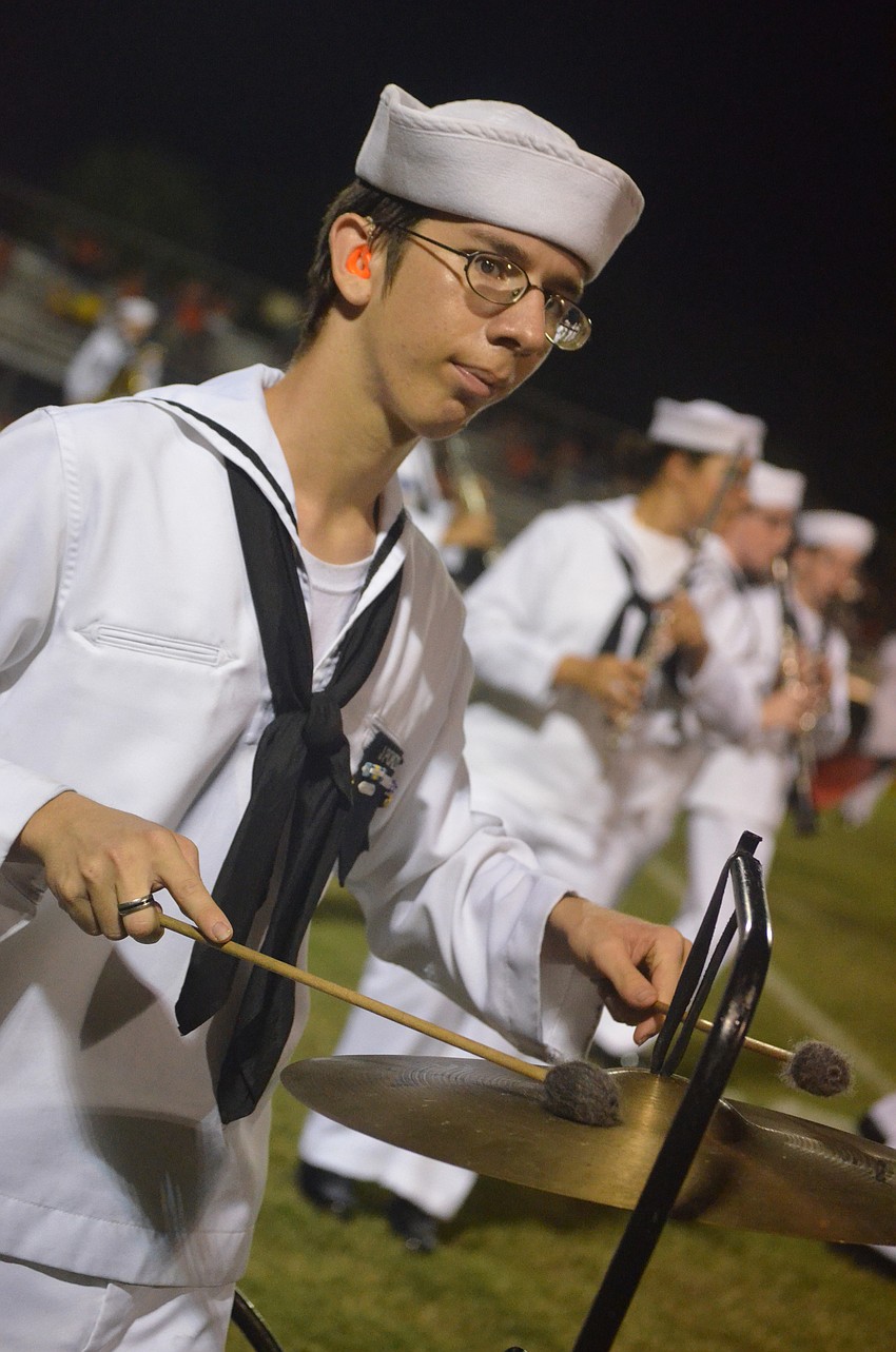 Sarasota High School senior Josh Ponzo plays the cymbals during the half time show.