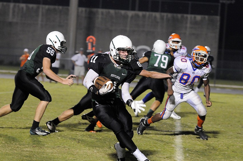 Lakewood Ranch running back JT Fischer carries the ball late in the fourth quarter.