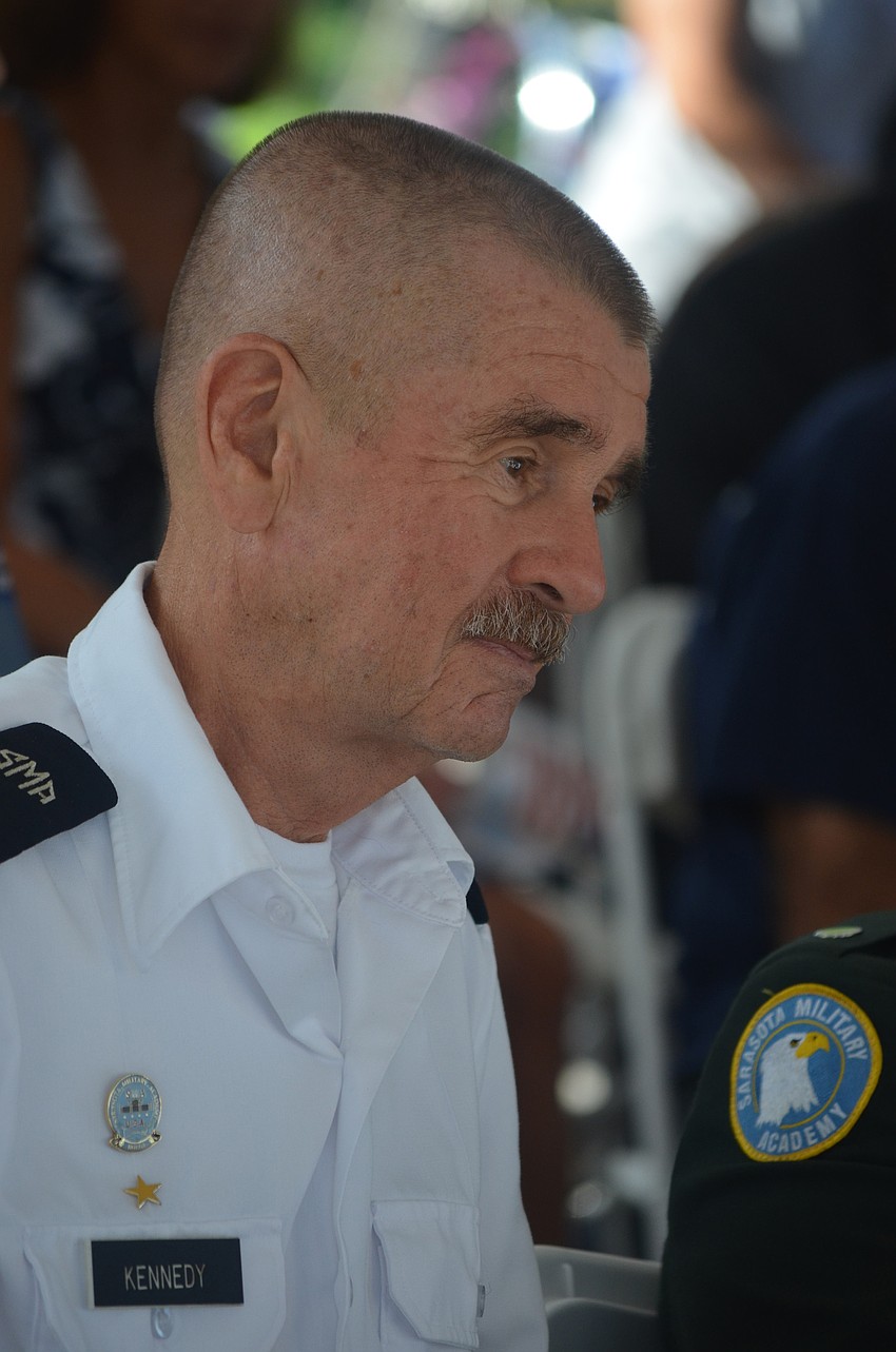 Sarasota Military Academy Headmaster Dan Kennedy listens to remarks from community leaders at the Sarasota Police Department.