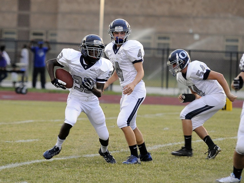 Freshman Josh Lerner carries the ball early in the first quarter.