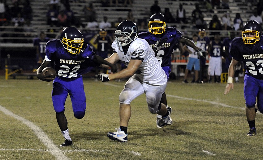 ODA senior linebacker Max Provost attempts to bring down Booker running back Bill Jackson in the second half.