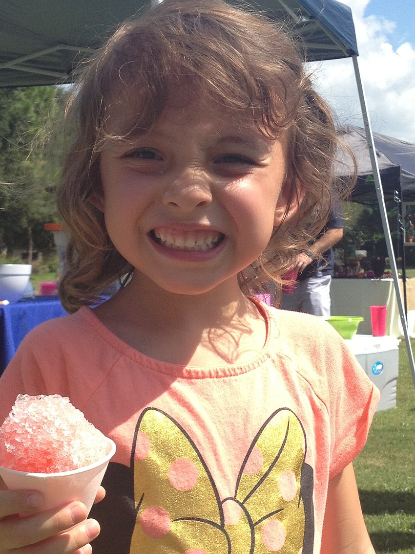 Reese Gurksi happily matches her snow cone