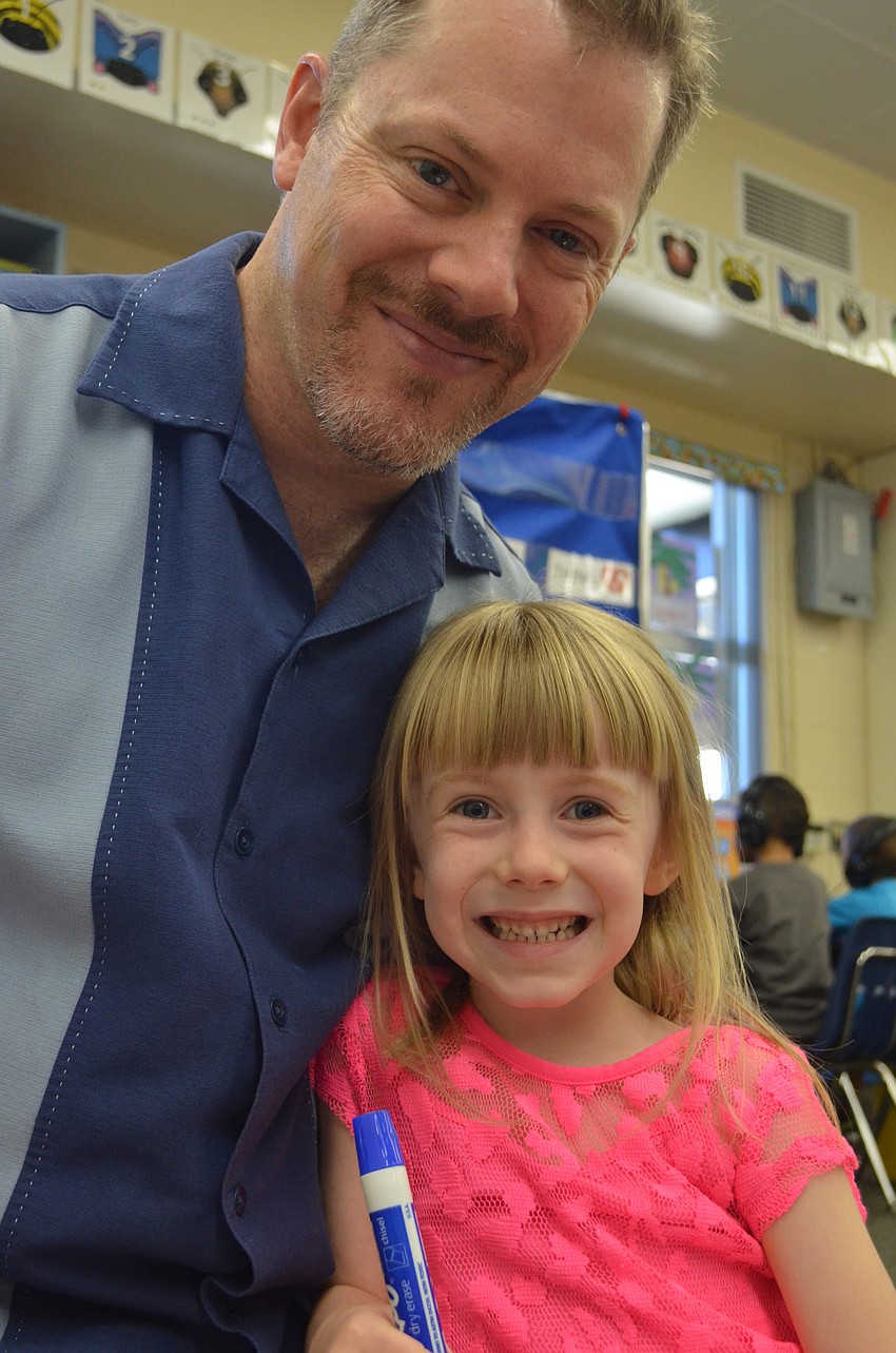 Christopher Schnell draws with his daughter, Adelaide, for Take Your Dad to School Day.