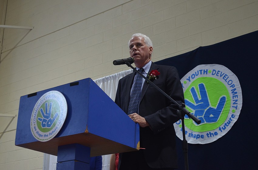 Dan Bailey gives remarks after receiving recognition for his work with CYD.