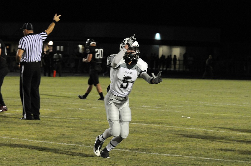 Lakewood Ranch defensive back Brendan Lewellen celebrates following a Mustangs fumble recovery in the fourth quarter.