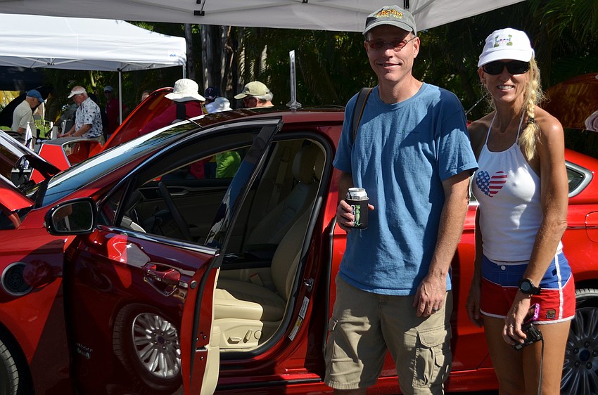 Brian and Terri Bowers check out the electric Ford Fusion at the Electrify the Island EV expo.