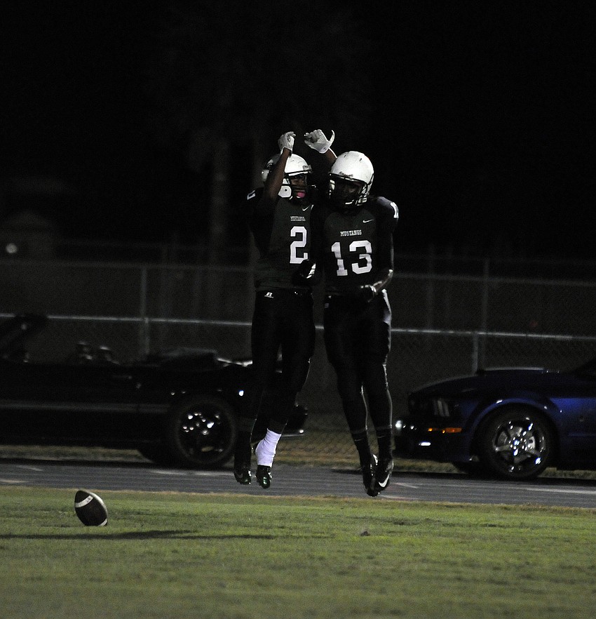 Wide receivers Cameron Pearcey and Terez Davis celebrate following Pearceyâ€™s 19-yard touchdown on Lakewoodâ€™s opening drive of the game.