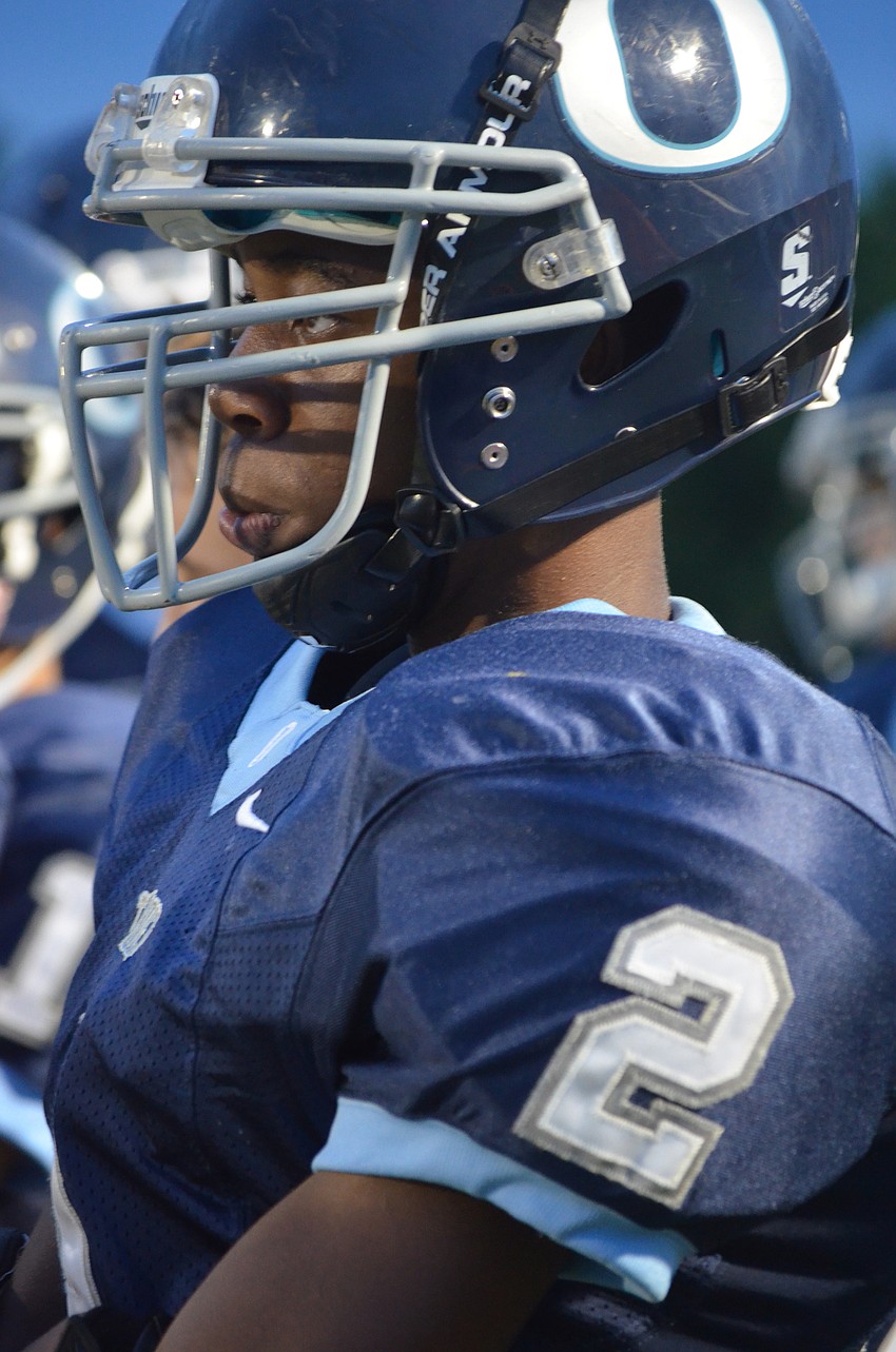 Running back Amad Brayboy watches his teammates from the sidelines.